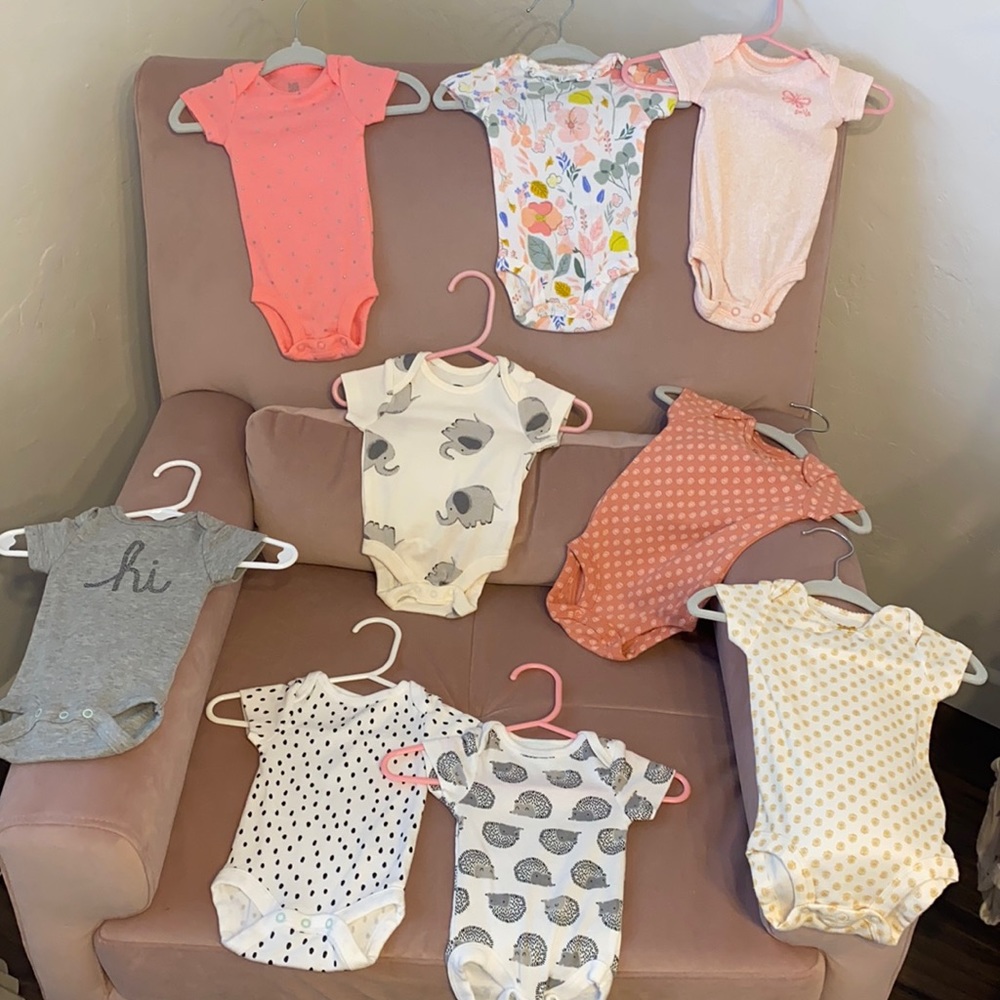 9 newborn onesies never been worn or used !